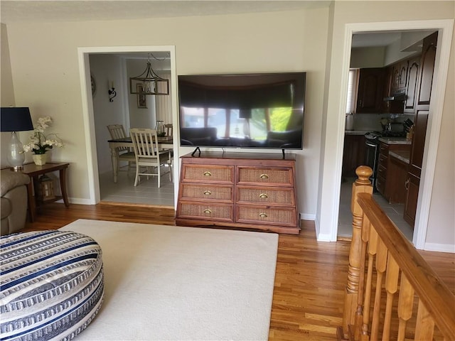 76 Belaire Dr, Big Flats, NY 14845 - living room featuring wood finished floors and baseboards