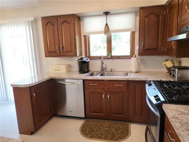 76 Belaire Dr, Big Flats, NY 14845 - kitchen with a sink, appliances with stainless steel finishes, under cabinet range hood, a peninsula, and pendant lighting