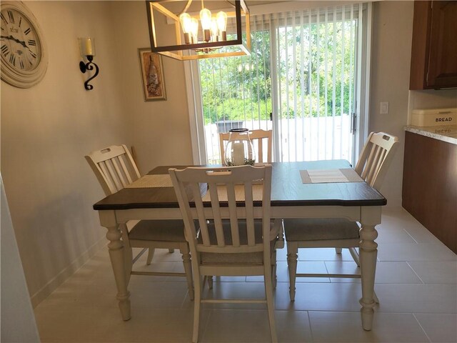 76 Belaire Dr, Big Flats, NY 14845 - dining area featuring a chandelier