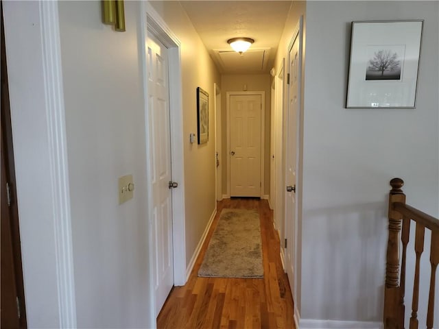 76 Belaire Dr, Big Flats, NY 14845 - hall with attic access, light wood-type flooring, and baseboards