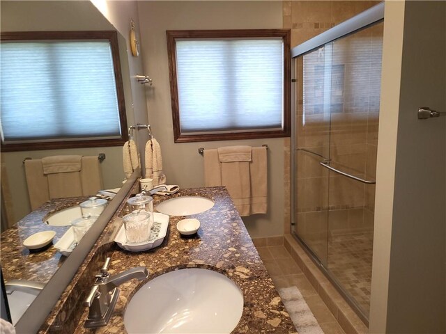 76 Belaire Dr, Big Flats, NY 14845 - full bath featuring a stall shower, double vanity, and tile patterned floors