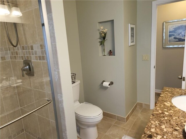 76 Belaire Dr, Big Flats, NY 14845 - bathroom with toilet, a stall shower, vanity, tile patterned flooring, and baseboards