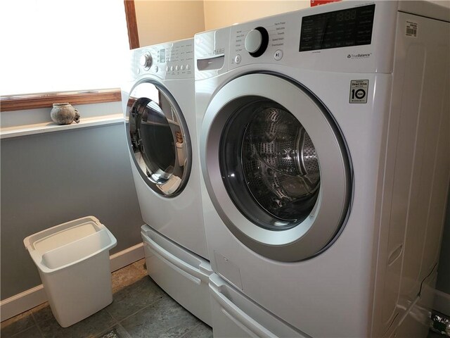 76 Belaire Dr, Big Flats, NY 14845 - laundry area featuring washing machine and dryer and baseboards