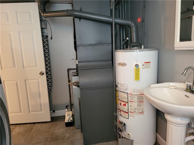 76 Belaire Dr, Big Flats, NY 14845 - utilities with gas water heater and a sink