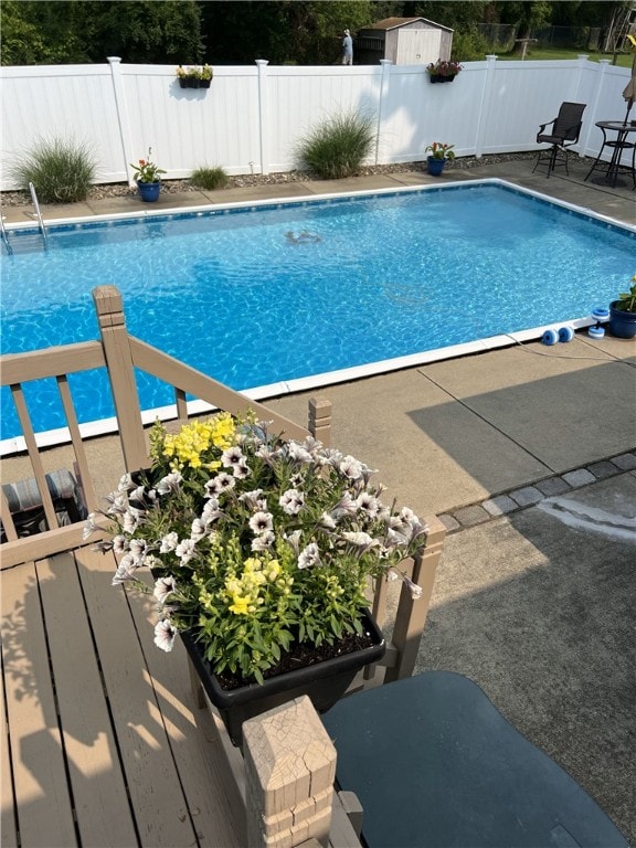 76 Belaire Dr, Big Flats, NY 14845 - view of pool with a fenced backyard and a patio area