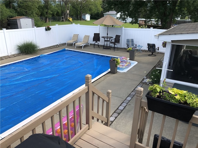 76 Belaire Dr, Big Flats, NY 14845 - view of pool featuring a patio and a fenced backyard