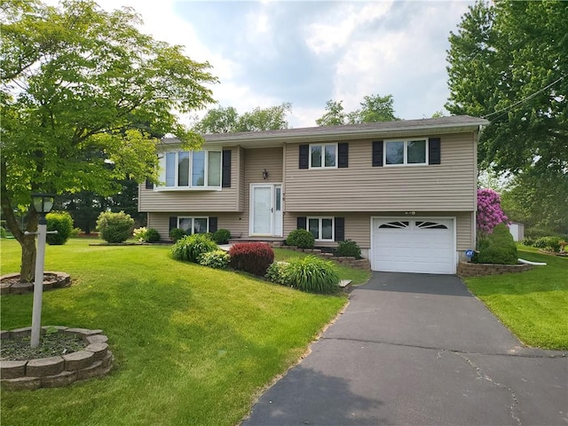 76 Belaire Dr, Big Flats, NY 14845 - raised ranch with a garage, a front yard, and asphalt driveway
