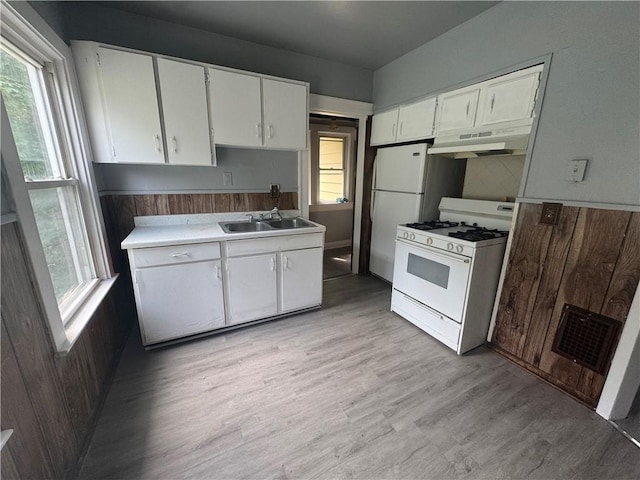 109 Avery St, Rochester, NY 14606 - kitchen with white range with gas cooktop, under cabinet range hood, a sink, and white cabinets