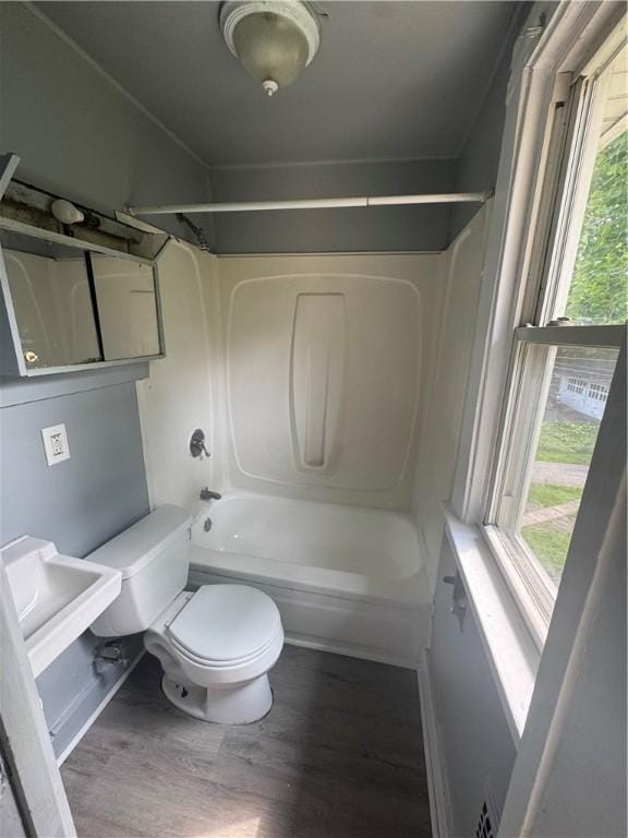 109 Avery St, Rochester, NY 14606 - full bathroom with toilet, wood finished floors, and shower / bathtub combination