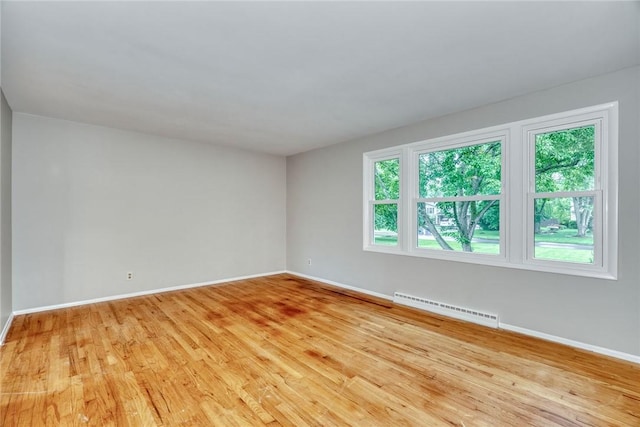 54 Hillary Dr, Chili, NY 14624 - unfurnished room with baseboard heating, baseboards, and light wood finished floors