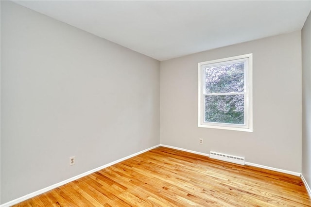 54 Hillary Dr, Chili, NY 14624 - spare room with baseboards and light wood finished floors