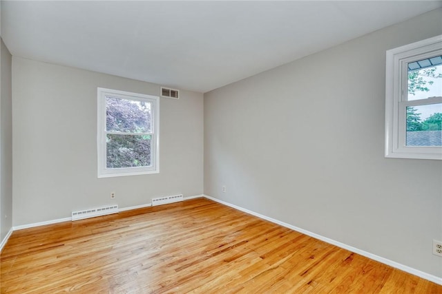 54 Hillary Dr, Chili, NY 14624 - unfurnished room featuring light wood-style flooring, baseboards, and a baseboard radiator