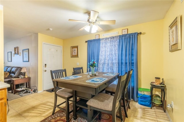 286 Troup St, Rochester, NY 14608 - dining room featuring a ceiling fan and light floors