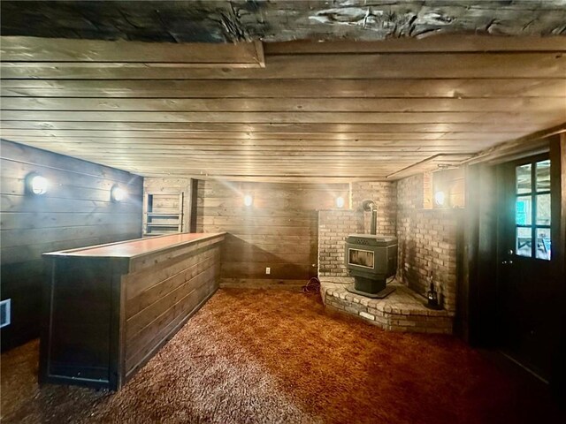 2095 Turnpike Rd, Throop, NY 13021 - interior space with a wood stove, carpet flooring, and wood ceiling
