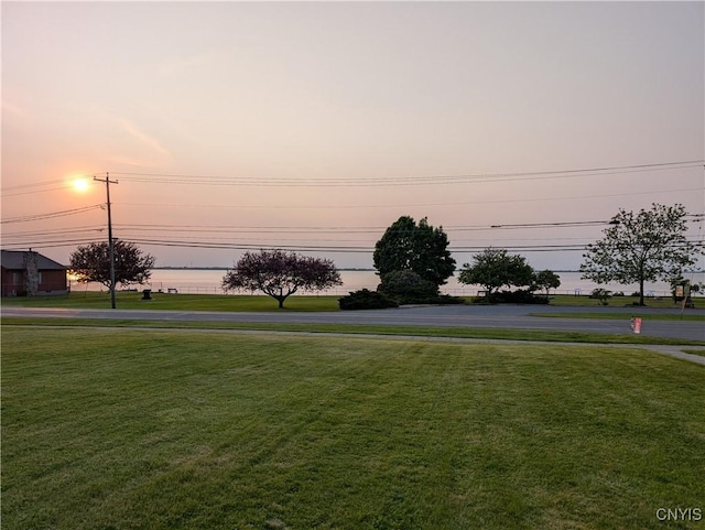 149 Centre St, Cape Vincent, NY 13618 - yard at dusk with a lawn