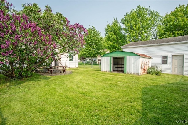 149 Centre St, Cape Vincent, NY 13618 - view of green lawn with an outdoor structure