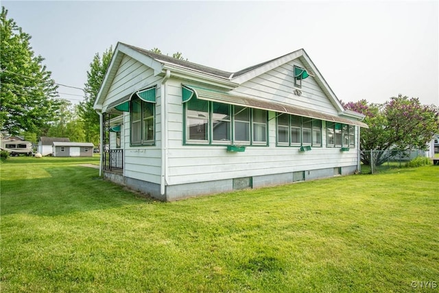 149 Centre St, Cape Vincent, NY 13618 - view of property exterior featuring a yard