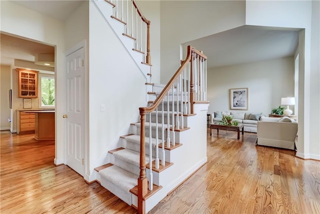 863 Rolins Run, Webster, NY 14580 - staircase featuring wood finished floors and baseboards