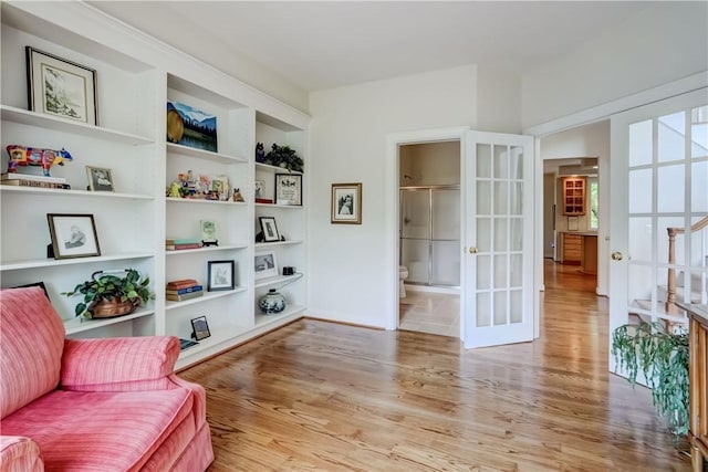 863 Rolins Run, Webster, NY 14580 - sitting room with french doors, wood finished floors, and built in shelves