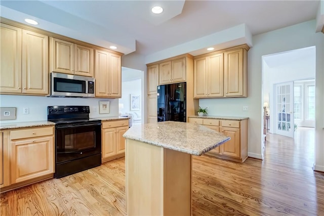 863 Rolins Run, Webster, NY 14580 - kitchen featuring black appliances, light brown cabinetry, light wood-style floors, recessed lighting, and a kitchen island