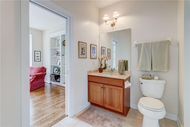 863 Rolins Run, Webster, NY 14580 - bathroom featuring vanity, toilet, and baseboards