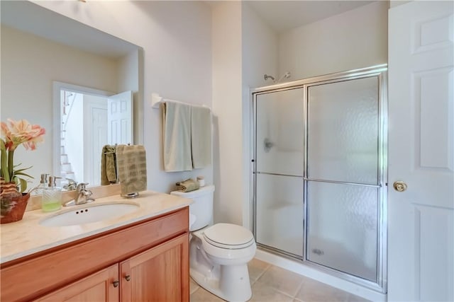 863 Rolins Run, Webster, NY 14580 - bathroom featuring a stall shower, vanity, toilet, and tile patterned flooring