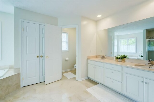863 Rolins Run, Webster, NY 14580 - full bath with a bath, double vanity, toilet, a closet, and a shower