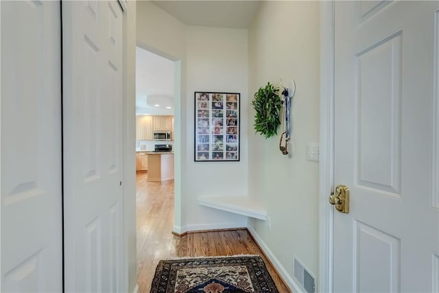 863 Rolins Run, Webster, NY 14580 - mudroom with light wood-style flooring and baseboards