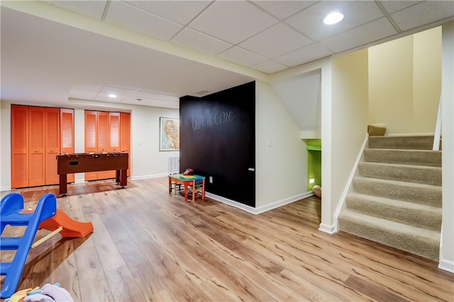 863 Rolins Run, Webster, NY 14580 - recreation room featuring baseboards, a drop ceiling, light wood-type flooring, and recessed lighting