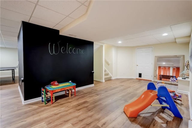 863 Rolins Run, Webster, NY 14580 - rec room featuring light wood-style floors, baseboards, a paneled ceiling, and recessed lighting