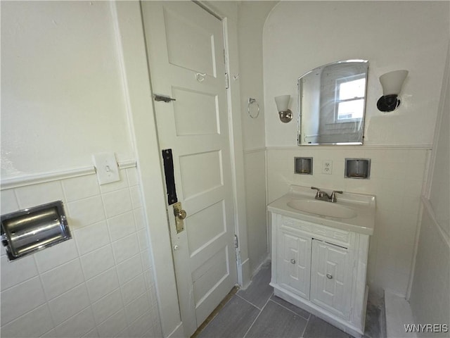 1618 16th St, Niagara Falls, NY 14305 - bathroom with tile walls, vanity, tile patterned flooring, and wainscoting