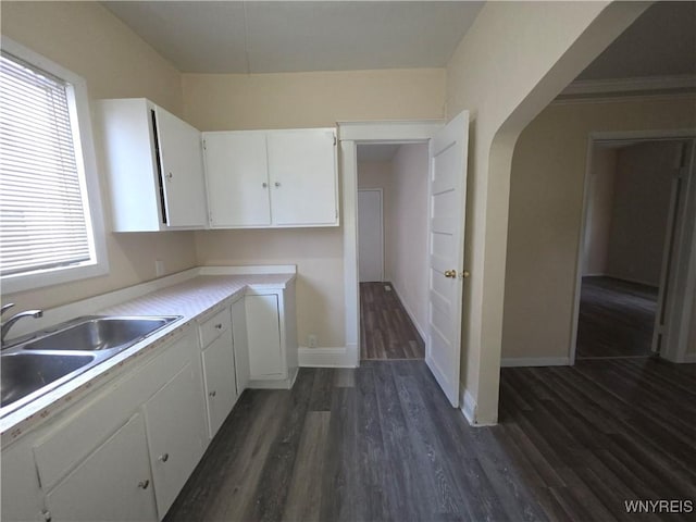 1618 16th St, Niagara Falls, NY 14305 - kitchen featuring dark wood-style flooring, white cabinets, a sink, and light countertops