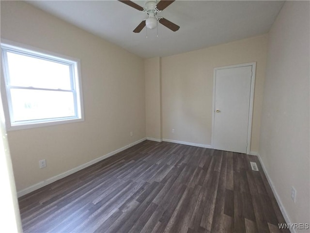 1618 16th St, Niagara Falls, NY 14305 - unfurnished room with dark wood-style flooring, ceiling fan, and baseboards