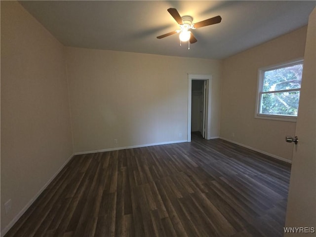 1618 16th St, Niagara Falls, NY 14305 - spare room featuring dark wood finished floors, baseboards, and ceiling fan