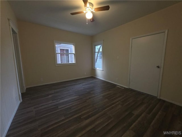 1618 16th St, Niagara Falls, NY 14305 - spare room featuring dark wood-type flooring, baseboards, and a ceiling fan