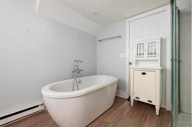 53 University Ave, Hamilton, NY 13346 - full bathroom featuring a baseboard heating unit, wood finished floors, and a freestanding tub