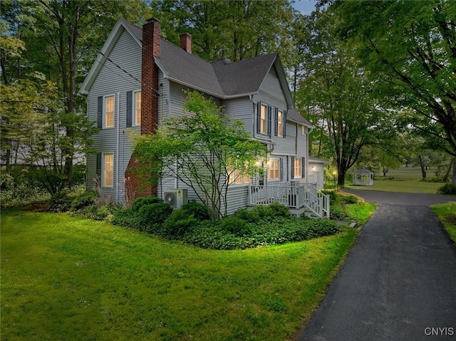 53 University Ave, Hamilton, NY 13346 - view of property exterior with a chimney and a lawn