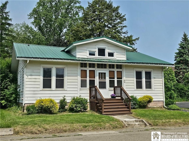 1 Parkway St, Hanover, NY 14136 - bungalow with a front lawn, metal roof, and entry steps