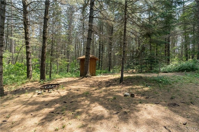 6372 George Hill Rd, Watson, NY 13343 - view of yard featuring a fire pit and a view of trees
