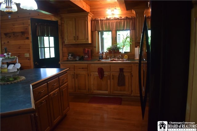 6615 Java Lake Rd, Arcade, NY 14009 - kitchen with a sink, wooden walls, healthy amount of natural light, light wood-type flooring, and freestanding refrigerator