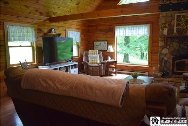 6615 Java Lake Rd, Arcade, NY 14009 - living area featuring a baseboard heating unit, healthy amount of natural light, wood walls, vaulted ceiling, and wood finished floors