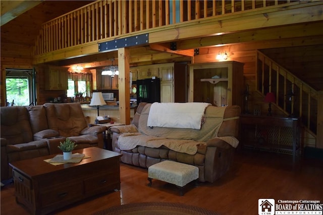 6615 Java Lake Rd, Arcade, NY 14009 - living room with wooden walls, high vaulted ceiling, wood finished floors, and a chandelier