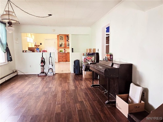 465 Willett St, Buffalo, NY 14206 - living area with wood finished floors, baseboard heating, and ornamental molding