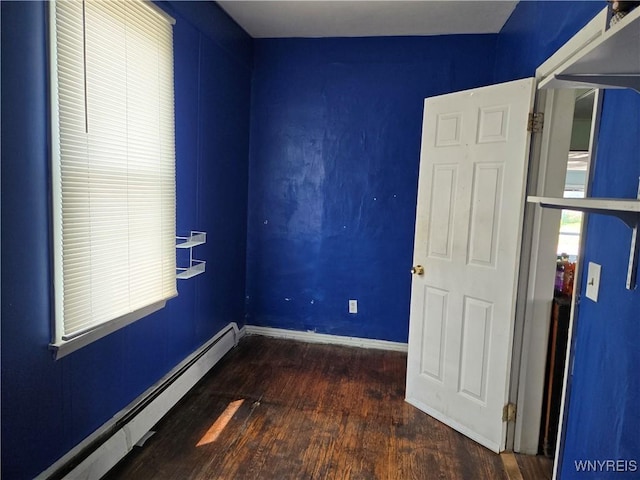 465 Willett St, Buffalo, NY 14206 - unfurnished bedroom with a baseboard radiator, wood finished floors, and baseboards