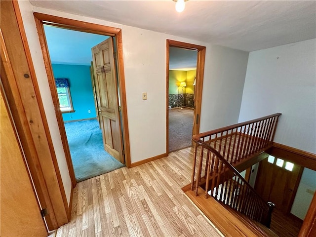 6956 E Washington St, Bath, NY 14810 - hall featuring an upstairs landing, light wood finished floors, and baseboards