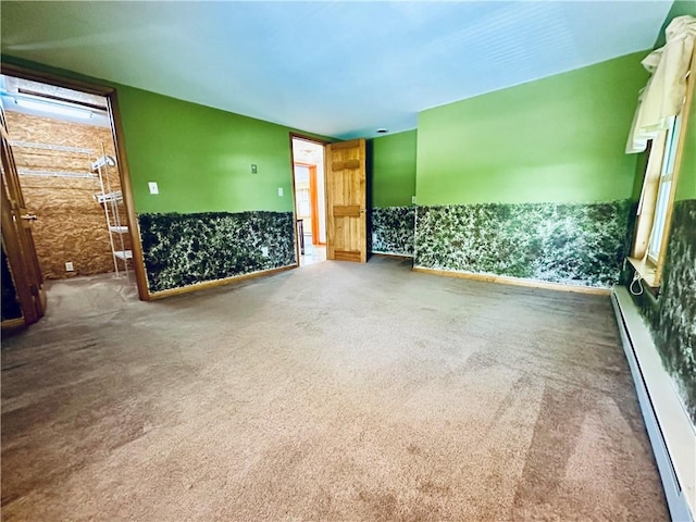 6956 E Washington St, Bath, NY 14810 - unfurnished room featuring a baseboard radiator and carpet flooring