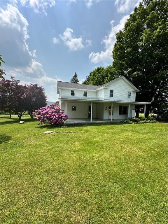 6956 E Washington St, Bath, NY 14810 - rear view of property with a lawn and a porch