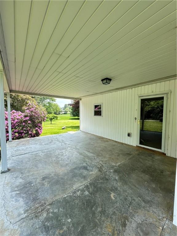 6956 E Washington St, Bath, NY 14810 - view of patio with a carport