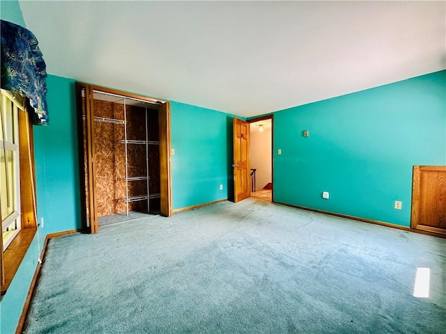 6956 E Washington St, Bath, NY 14810 - unfurnished bedroom featuring carpet and baseboards