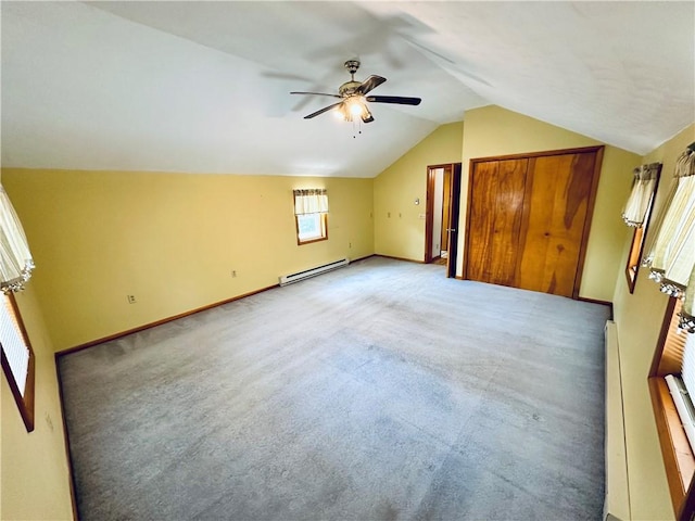 6956 E Washington St, Bath, NY 14810 - unfurnished bedroom with a baseboard heating unit, lofted ceiling, baseboards, light colored carpet, and ceiling fan